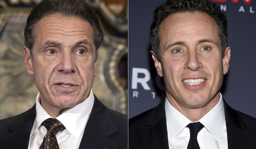 New York Gov. Andrew M. Cuomo, Cuomo appears during a news conference about the COVID-19 vaccine at the State Capitol in Albany, N.Y., on Dec. 3, 2020, left, and CNN anchor Chris Cuomo attends the 12th annual CNN Heroes: An All-Star Tribute at the American Museum of Natural History in New York on Dec. 9, 2018.  CNN said it had reinstated a prohibition on Chris Cuomo interviewing or doing stories about his brother. The policy avoids a conflict of interest or at the very least the appearance of one. (Mike Groll/Office of Governor of Andrew M. Cuomo via AP, left, and Evan Agostini/Invision/AP)