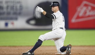 FILE - In this Sept. 19, 2019, file photo, New York Yankees&#x27; Brett Gardner gestures from second base after hitting an RBI double during the sixth inning of the teams&#x27; baseball game against the Los Angeles Angels in New York. Gardner is returning to the Yankees for a 14th season. The 37-year outfielder and New York agreed Friday to a $4 million, one-year contract, a person familiar with the negotiations told The Associated Press. (AP Photo/Mary Altaffer, File)