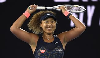 Japan&#39;s Naomi Osaka celebrates after defeating United States&#39; Jennifer Brady during the women&#39;s singles final at the Australian Open tennis championship in Melbourne, Australia, Saturday, Feb. 20, 2021..(AP Photo/Andy Brownbill)