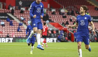 Chelsea&#x27;s Mason Mount, left, celebrates after scoring his side&#x27;s opening goal during the English Premier League soccer match between Chelsea and Southampton at St. Mary&#x27;s Stadium in Southampton, England, Saturday, Feb.20, 2021. Michael Steele/Pool via AP)