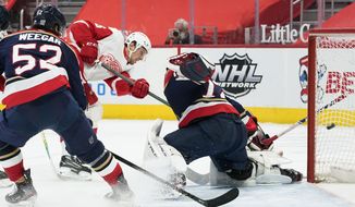 Detroit Red Wings left wing Mathias Brome (86) scores on Florida Panthers goaltender Sergei Bobrovsky (72) in the second period of an NHL hockey game Saturday, Feb. 20, 2021, in Detroit. (AP Photo/Paul Sancya)