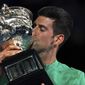 Serbia&#39;s Novak Djokovic kisses the Norman Brookes Challenge Cup after defeating Russia&#39;s Daniil Medvedev in the men&#39;s singles final at the Australian Open tennis championship in Melbourne, Australia, Sunday, Feb. 21, 2021.(AP Photo/Mark Dadswell)