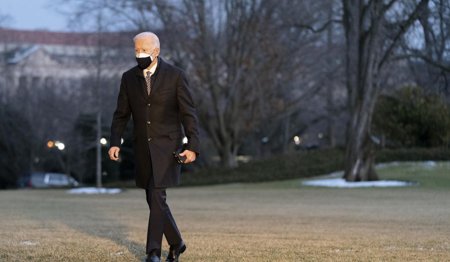President Joe Biden walks on the South Lawn of the White House after stepping off Marine One, Friday, Feb. 19, 2021, in Washington. Biden is returning to Washington after visiting Pfizer&#x27;s COVID-19 vaccine manufacturing site near Kalamazoo, Mich. (AP Photo/Patrick Semansky)