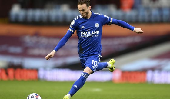 Leicester&#39;s James Maddison kicks the ball during the English Premier League soccer match between Aston Villa and Leicester City at Villa Park in Birmingham, England, Sunday, Feb. 21, 2021. (AP Photo/Michael Regan, Pool)