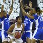 South Carolina forward Aliyah Boston (4) is surrounded by Kentucky forward Keke McKinney (3), Tatyana Wyatt (14), and Chasity Patterson (15) during the first half of an NCAA college basketball game Sunday, Feb. 21, 2021, in Columbia, S.C. (AP Photo/Sean Rayford)