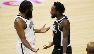Brooklyn Nets guard James Harden, left, talks with Los Angeles Clippers guard Patrick Beverley after a confrontation in the first half of an NBA basketball game Sunday, Feb. 21, 2021, in Los Angeles. (AP Photo/Mark J. Terrill)