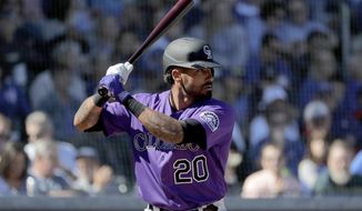 Colorado Rockies&#39; Ian Desmond during the first inning of a spring training baseball game against the Chicago Cubs, Tuesday, Feb. 25, 2020, in Mesa, Ariz. Desmond announced Sunday, Feb. 21, 2021 he is opting out for a second straight season. Desmond announced on his Instagram account that his “desire to be with my family is greater than my desire to go back and play baseball under these circumstances. I&#39;m going to train and watch how things unfold.” He added “for now&amp;quot; in his statement to opt out, leaving the door open for a possible return. (AP Photo/Matt York, file)