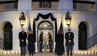 From left, President Joe Biden, first lady Jill Biden, Vice President Kamala Harris and her husband Doug Emhoff, bow their heads during a ceremony to honor the 500,000 Americans that died from COVID-19, at the White House, Monday, Feb. 22, 2021, in Washington. (AP Photo/Evan Vucci)