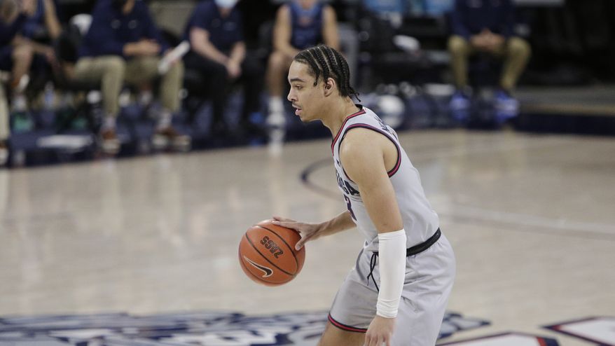 Gonzaga guard Andrew Nembhard handles the ball during the second half of an NCAA college basketball game against San Diego in Spokane, Wash., Saturday, Feb. 20, 2021. (AP Photo/Young Kwak) **FILE**