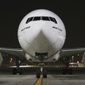 CORRECTS DATE TO EARLY SUNDAY FEB. 21, 2021 - An Emirates Airlines Boing 777 arrives from Brussels to deliver Pfizer-BioNTech COVID-19 coronavirus vaccines shipment at Dubai International Airport in Dubai, United Arab Emirates, early Sunday, Feb. 21, 2021. As the coronavirus pandemic continues to clobber the aviation industry, Emirates Airlines, the Middle East’s biggest airline is seeking to play a vital role in the global vaccine delivery effort. (AP Photo/Kamran Jebreili)