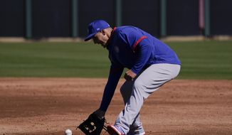 Chicago Cubs&#39; Anthony Rizzo fields the ball during the team&#39;s spring training baseball workout in Mesa, Ariz., Monday, Feb. 22, 2021. (AP Photo/Jae C. Hong)