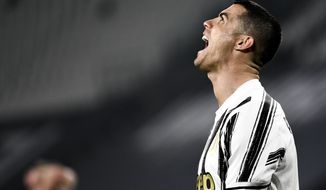 Juventus&#39; Cristiano Ronaldo rues a missed chance on goal during the Serie A soccer match between Juventus and Crotone, at the Allianz Stadium in Turin, Italy, Monday, Feb. 22, 2021. (Marco Alpozzi/LaPresse via AP)