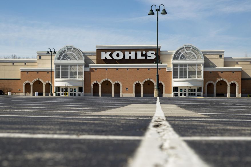 An empty parking outside a closed Kohl's store is shown in Indianapolis, Thursday, April 2, 2020. Kohl’s is fighting back against an investor group’s efforts to take control of the department store chain's board, arguing that it would derail its progress and momentum. The response, issued Monday, Feb. 22, 2021 comes after the investor group said it had nominated nine members for Kohl's board of directors as it looks to boost the company's stock and its financial performance. The group owns a 9.5% stake in Kohl's. (AP Photo/Michael Conroy, file)
