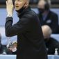 Louisville head coach Chris Mack directs his players on defense against North Carolina during the first half of an NCAA college basketball game, Saturday, Feb. 20, 2021, at the Smith Center in Chapel Hill, N.C. (Robert Willett/The News &amp;amp; Observer via AP)