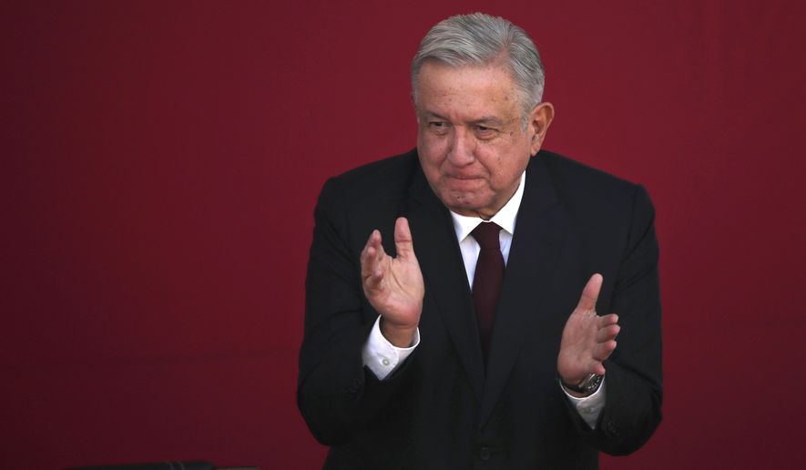 Mexican President Andres Manuel Lopez Obrador applauds during a ceremony marking the 108th anniversary of the Marcha de la Lealtad or March of Loyalty, at Chapultepec Castle in Mexico City, Tuesday, Feb. 9, 2021. The ceremony commemorates the day in 1913 when hundreds of military cadets accompanied democratically elected president Francisco I. Maduro from Chapultepec Castle to the National Palace at the start of a coup known as the "Decena Tragica,” or Ten Tragic Days. (AP Photo/Marco Ugarte)