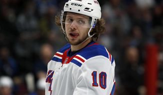 FILE - New York Rangers left wing Artemi Panarin (10) is shown in the second period of an NHL hockey game in Denver, in this Wednesday, March 11, 2020, file photo. New York Rangers star Artemi Panarin is taking a leave of absence after a Russian tabloid printed allegations from a former coach that he attacked an 18-year-old woman in Latvia in 2011. Ex-NHL enforcer Andrei Nazarov is the source for the report after coaching Panarin in the Kontinental Hockey League. Nazarov says he was motivated to speak about it because he disagreed with Panarin’s repeated criticism of the Russian government. Panarin denied the allegations in a statement released by the Rangers. (AP Photo/David Zalubowski, File)