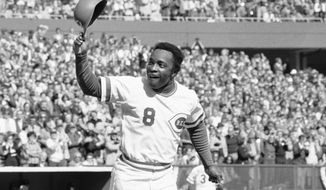 FILE - In this Saturday, Oct. 16, 1976, file photo, Cincinnati second baseman Joe Morgan tips his helmet to the fans as he rounds the bases after a homer in the first inning against the New York Yankees at Riverfront Stadium in Cincinnati. The affection drenches Clint Hurdle’s voice when he talks of them, when he appraises the list of those recently gone — childhood idols who became teammates and opponents, teammates and opponents who became acquaintances, acquaintances who became friends.(AP Photo/File)