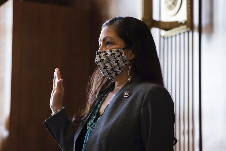 Rep. Deb Haaland, D-N.M., is sworn in during a Senate Committee on Energy and Natural Resources hearing on her nomination to be Interior secretary, Tuesday, Feb. 23, 2021 on Capitol Hill in Washington. (Graeme Jennings/Pool via AP)