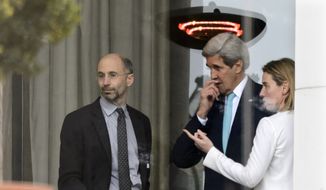 In this file photo from April 1, 2015, High Representative of the European Union for Foreign Affairs and Security Policy Federica Mogherini, right, speaks with then-U.S. Secretary of State John Kerry, center, and U.S. Robert Malley, left, Senior Director for Iran, Iraq, and the Gulf States, National Security Council during a break outside the hotel at the Beau Rivage Palace Hotel as the Iran nuclear talks continue, in Lausanne, Switzerland, Wednesday, April 1, 2015. Malley currently serves as the Biden administration&#39;s special envoy to Iran and is working to salvage the Obama-era Iran deal that President Trump canceled. (AP Photo/Keystone,Laurent Gillieron)  ** FILE **