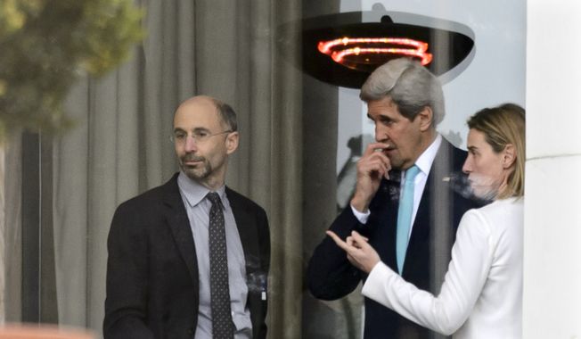 In this file photo from April 1, 2015, High Representative of the European Union for Foreign Affairs and Security Policy Federica Mogherini, right, speaks with then-U.S. Secretary of State John Kerry, center, and U.S. Robert Malley, left, Senior Director for Iran, Iraq, and the Gulf States, National Security Council during a break outside the hotel at the Beau Rivage Palace Hotel as the Iran nuclear talks continue, in Lausanne, Switzerland, Wednesday, April 1, 2015. Malley currently serves as the Biden administration&#x27;s special envoy to Iran and is working to salvage the Obama-era Iran deal that President Trump canceled. (AP Photo/Keystone,Laurent Gillieron)  ** FILE **