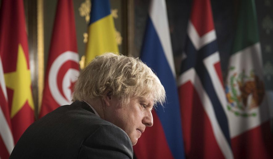 Britain&#x27;s Prime Minister Boris Johnson chairs a session of the UN Security Council on climate and security at the Foreign, Commonwealth and Development Office in London, Tuesday, Feb. 23, 2021. (Stefan Rousseau/Pool Photo via AP)