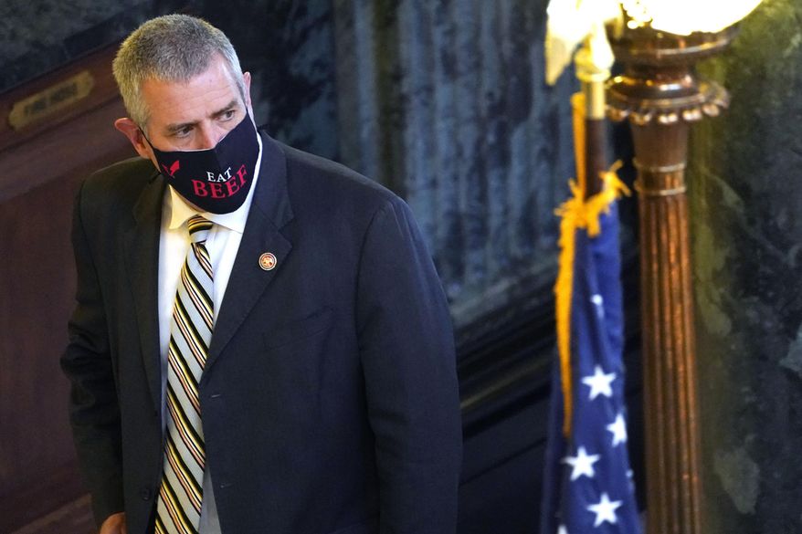 House Speaker Philip Gunn, R-Clinton, looks down the hall as he returns from lunch to the Capitol in Jackson, Miss., Wednesday, Feb. 3, 2021. Some legislators have taken to wearing logo bearing, fashionable masks or message bearing masks as opposed to the government provided surgical-type masks. (AP Photo/Rogelio V. Solis) .