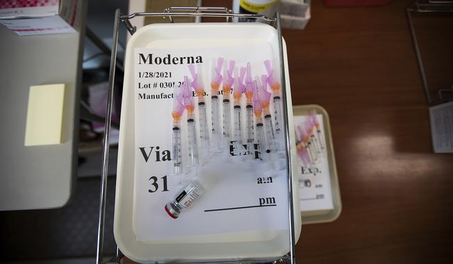 Doses of the Moderna COVID-19 vaccine are seen inside of the pharmacy station at the Hamilton County Health Department&#x27;s new COVID Vaccination POD at the CARTA Bus Terminal on Thursday, Jan. 28, 2021 in Chattanooga, Tenn. (Troy Stolt/Chattanooga Times Free Press via AP)