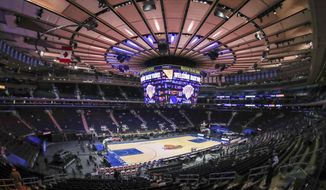 Fans arrive for an NBA basketball game between the Golden State Warriors and the New York Knicks on Tuesday, Feb. 23, 2021, in New York. A limited number of fans were allowed to attend. (Wendell Cruz/Pool Photo via AP)
