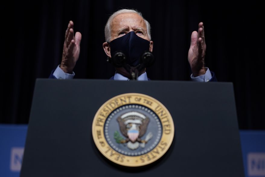 In this Feb. 11, 2021, file photo, President Joe Biden speaks during a visit to the Viral Pathogenesis Laboratory at the National Institutes of Health in Bethesda, Md. A federal judge late Tuesday, Feb. 23, 2021,  indefinitely banned President Joe Biden&#x27;s administration from enforcing a 100-day moratorium on most deportations. (AP Photo/Evan Vucci, File)