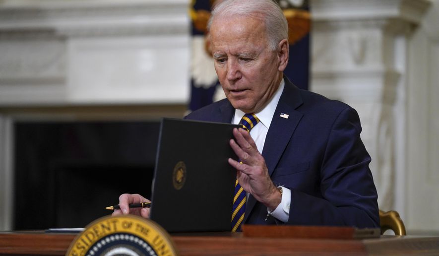 President Joe Biden closes the folder after signing an executive order relating to U.S. supply chains, in the State Dining Room of the White House, Wednesday, Feb. 24, 2021, in Washington. (AP Photo/Evan Vucci)