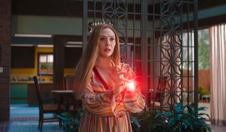 This image provided by Marvel Studios shows Elizabeth Olsen as Wanda Maximoff in a scene from &amp;quot;WandaVision.&amp;quot; (Marvel Studios via AP)