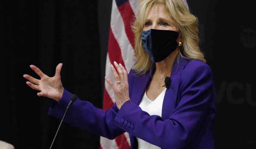 First lady Jill Biden gestures as she speaks during a visit to the Massey Cancer center at Virginia Commonwealth University for a discussion about cancer disparities. in Richmond, Va., Wednesday, Feb. 24, 2021. (AP Photo/Steve Helber)