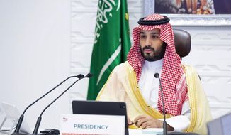 In this Sunday, Nov. 22, 2020, file photo, Saudi Arabia&#39;s Crown Prince Mohammed bin Salman attends a virtual G-20 summit held over video conferencing, in Riyadh, Saudi Arabia. (Bandar Aljaloud/Saudi Royal Palace via AP, File)