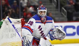 In this Feb. 1, 2020, file photo, New York Rangers goaltender Henrik Lundqvist plays against the Detroit Red Wings in the second period of an NHL hockey game in Detroit. Lundqvist says he is months away from making a decision about his hockey-playing future after returning to the ice less than two months since undergoing open-heart surgery. (AP Photo/Paul Sancya, File)  **FILE**