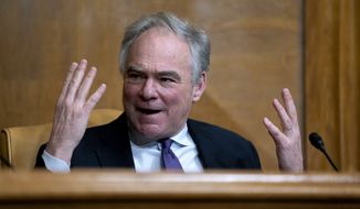 Sen. Tim Kaine, D-Va., speaks during a U.S. Senate Budget Committee hearing regarding wages at large corporations on Capitol Hill in Washington, Thursday, Feb. 25, 2021. (Stefani Reynolds/The New York Times via AP, Pool)