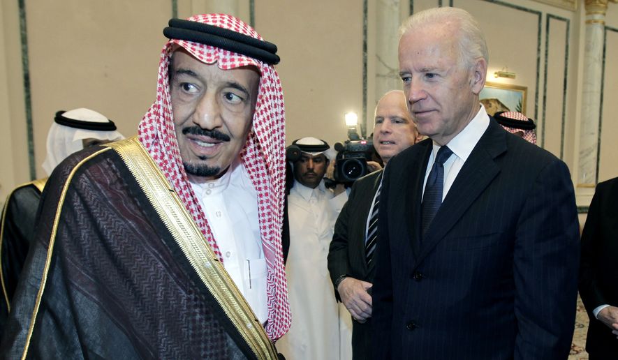 In this Oct. 27, 2011, file photo, then U.S. Vice President Joe Biden, right, offers his condolences to then Prince Salman bin Abdel-Aziz upon the death of his brother Saudi Crown Prince Sultan bin Abdul-Aziz Al Saud, at Prince Sultan palace in Riyadh, Saudi Arabia. President Joe Biden is expected to speak to Saudi King Salman for the first time in Biden’s just over a month-old administration. (AP Photo/Hassan Ammar) ** FILE **