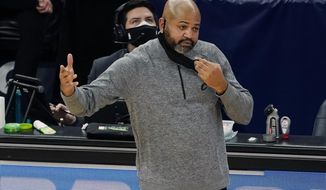 Cleveland Indians head coach J B.Bickerstaff directs his team in the second half of an NBA basketball game against the Minnesota Timberwolves, Sunday, Jan. 31, 2021, in Minneapolis. (AP Photo/Jim Mone)