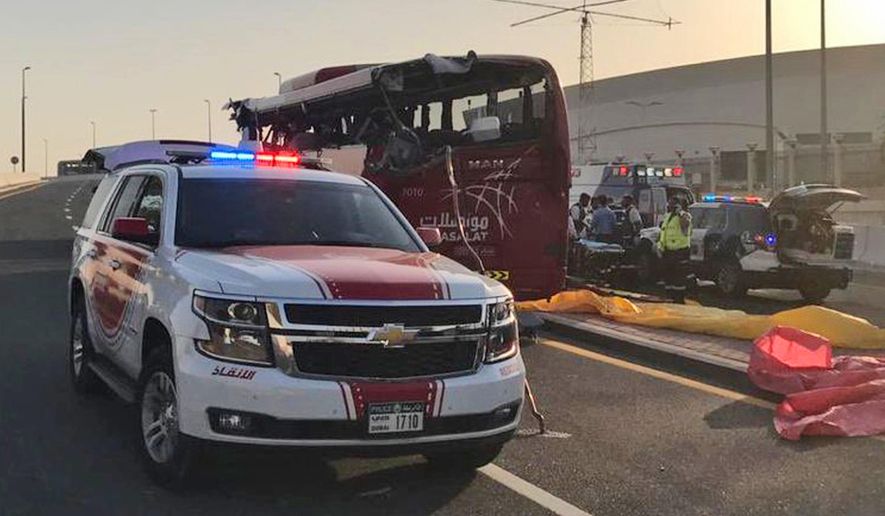 FILE - This June 7, 2019 file photo released by Dubai Police Headquarters shows the aftermath of a bus crash, in Dubai, United Arab Emirates. State-linked media in the UAE says a Dubai court has reduced the sentence of the Omani bus driver who smashed into a warning sign off a highway in 2019, killing 17 people on board. The appeals court reduced his seven-year sentence followed by deportation to just one year without deportation. (Dubai Police HQ via AP, File)