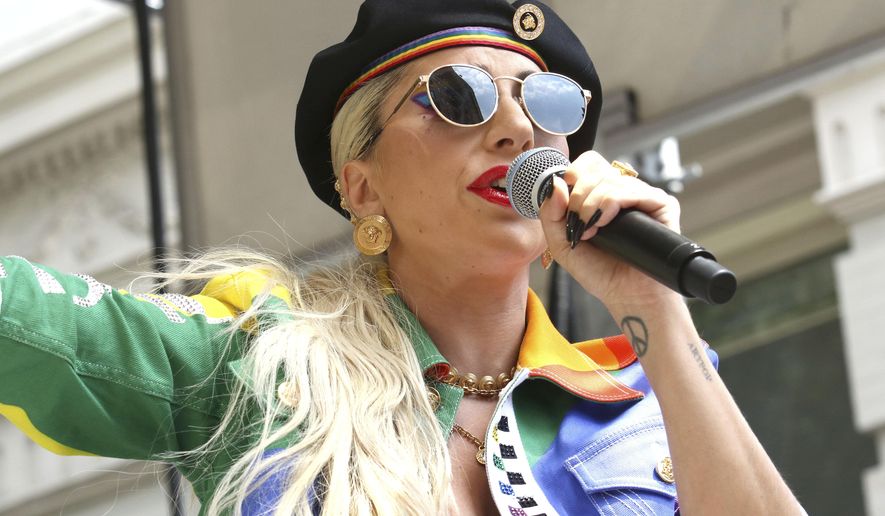 This June 28, 2019 file photo shows Lady Gaga performing in the second annual Stonewall Day honoring the 50th anniversary of the Stonewall riots, hosted by Pride Live and iHeartMedia in New York. Officials say Lady Gaga’s dog walker was shot and her two French bulldogs stolen in Hollywood during an armed robbery. Los Angeles police are seeking two suspects, thought it’s not known if both were armed, in connection with the Wednesday night shooting. (Photo by Greg Allen/Invision/AP, File)