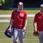Washington Nationals&#39; Ryan Zimmerman, left, walks toward the clubhouse with teammate Kyle Schwarber at the end of spring training baseball practice Thursday, Feb. 25, 2021, in West Palm Beach, Fla. (AP Photo/Jeff Roberson)