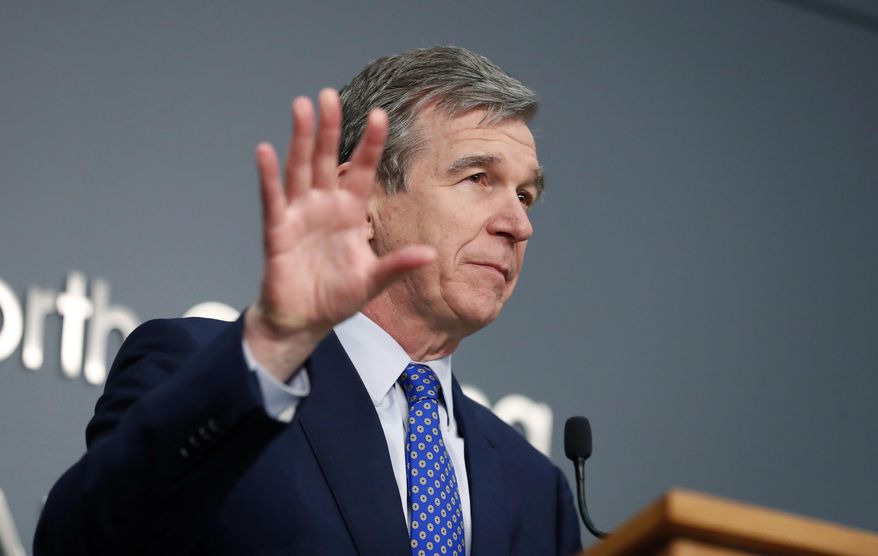 N.C. Gov. Roy Cooper speaks during a briefing at the Emergency Operations Center in Raleigh, N.C., Wednesday, Feb. 24, 2021. (Ethan Hyman/The News & Observer via AP)