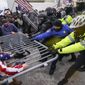 In this Jan. 6, 2021, file photo rioters try to break through a police barrier at the Capitol in Washington. (AP Photo/John Minchillo, File)