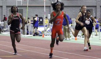 FILE — In this Feb. 7, 2019 file photo, Bloomfield High School transgender athlete Terry Miller, second from left, wins the final of the 55-meter dash over transgender athlete Andraya Yearwood, left, and other runners in the Connecticut girls Class S indoor track meet at Hillhouse High School in New Haven, Conn. Lawyers for several Connecticut school districts and the organization that oversees high school sports in the state went before a federal judge Friday, Feb. 26, 2021, seeking the dismissal of a lawsuit that would prevent transgender girls from competing in girl&#39;s sports. (AP Photo/Pat Eaton-Robb, File)