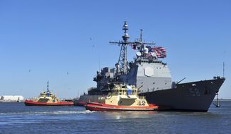 In this Feb. 15, 2014, photo released by the U.S. Navy, the guided-missile cruiser USS Philippine Sea leaves Naval Station Mayport in Mayport, Florida. Two U.S. Navy warships operating in the Mideast have been affected by the coronavirus, authorities said Friday, Feb. 26, 2021, with one already at port in Bahrain and another heading to port. The Philippine Sea will head to a port that the Navy declined to name over &amp;quot;operational security.&amp;quot; (Mass Communication Specialist 2nd Class Marcus L. Stanley/U.S. Navy, via AP)