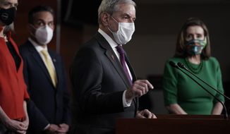 House Budget Committee Chairman John Yarmuth, D-Ky., speaks meets with reporters before the House votes to pass a $1.9 trillion pandemic relief package, during a news conference at the Capitol in Washington, Friday, Feb. 26, 2021. House Speaker Nancy Pelosi of Calif., is at right. (AP Photo/J. Scott Applewhite) ** FILE **