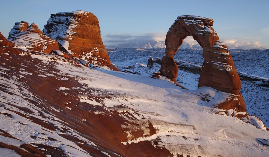 FILE - In this Dec. 31, 2010, file photo, snow covers delicate Arch at Arches National Park near Moab, Utah. Arches National Park may soon have a new neighbor, due to a new bill heading through the Utah legislature. &amp;quot;Utahraptor State Park,&amp;quot; proposed by Rep. Steve Eliason would be a new recreational area in Moab and Utah&#x27;s 44th state park, comprised of 6,500 acres, trails of every kind and campgrounds. (AP Photo/Julie Jacobson, File)