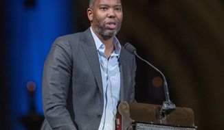 FILE - Author Ta-Nehisi Coates speaks during the Celebration of the Life of Toni Morrison in New York on Nov. 21, 2019. Coates, the acclaimed essayist and novelist who expanded the world of Wakanda in Marvel comics, will write the script for a new “Superman” film from Warner Bros. The studio announced Friday that Coates will pen the screenplay for an upcoming “Superman” film that’s early in development. (AP Photo/Mary Altaffer, File)