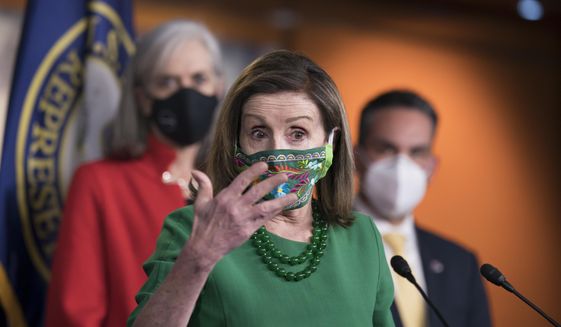 Speaker of the House Nancy Pelosi, D-Calif., meets with reporters before the House votes to pass a $1.9 trillion pandemic relief package, during a news conference at the Capitol in Washington, Friday, Feb. 26, 2021. Pelosi is flanked by Rep. Katherine Clark, D-Mass., left, and Rep. Pete Aguilar, D-Calif. (AP Photo/J. Scott Applewhite) ** FILE **