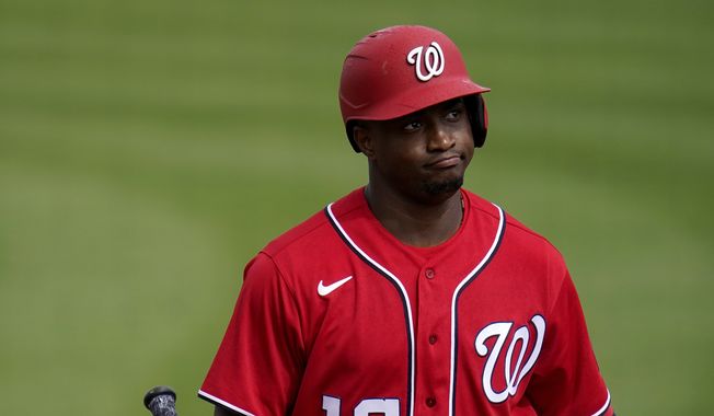 Washington Nationals&#x27; Victor Robles heads back to the dugout after striking out during the fourth inning of a spring training baseball game against the St. Louis Cardinals Sunday, Feb. 28, 2021, in Jupiter, Fla. (AP Photo/Jeff Roberson) **FILE**