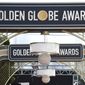 FILE - Event signage appears above the red carpet at the 77th annual Golden Globe Awards, on Jan. 5, 2020, in Beverly Hills, Calif. The 78th annual Golden Globes will be held on Sunday, Feb. 18, 2021.  (Photo by Jordan Strauss/Invision/AP, File)